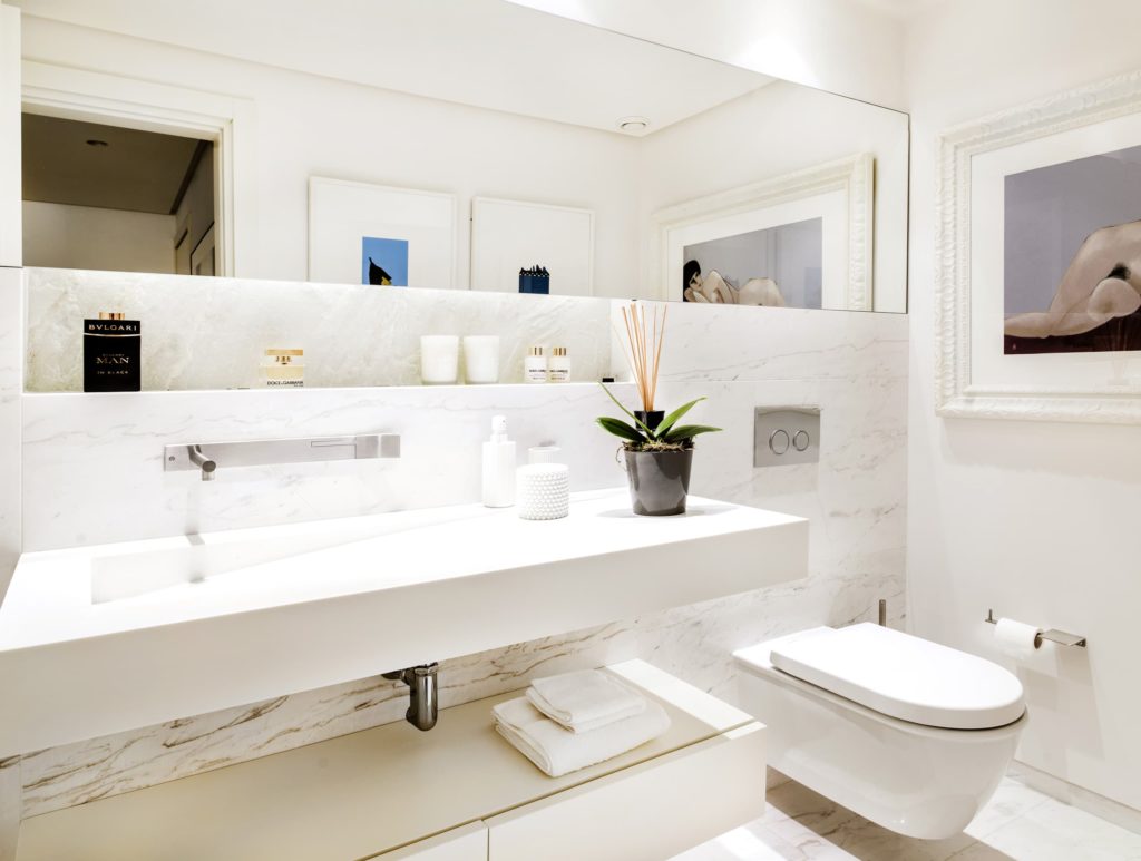 white bathroom with rectangular mirror in horizontal arrangement