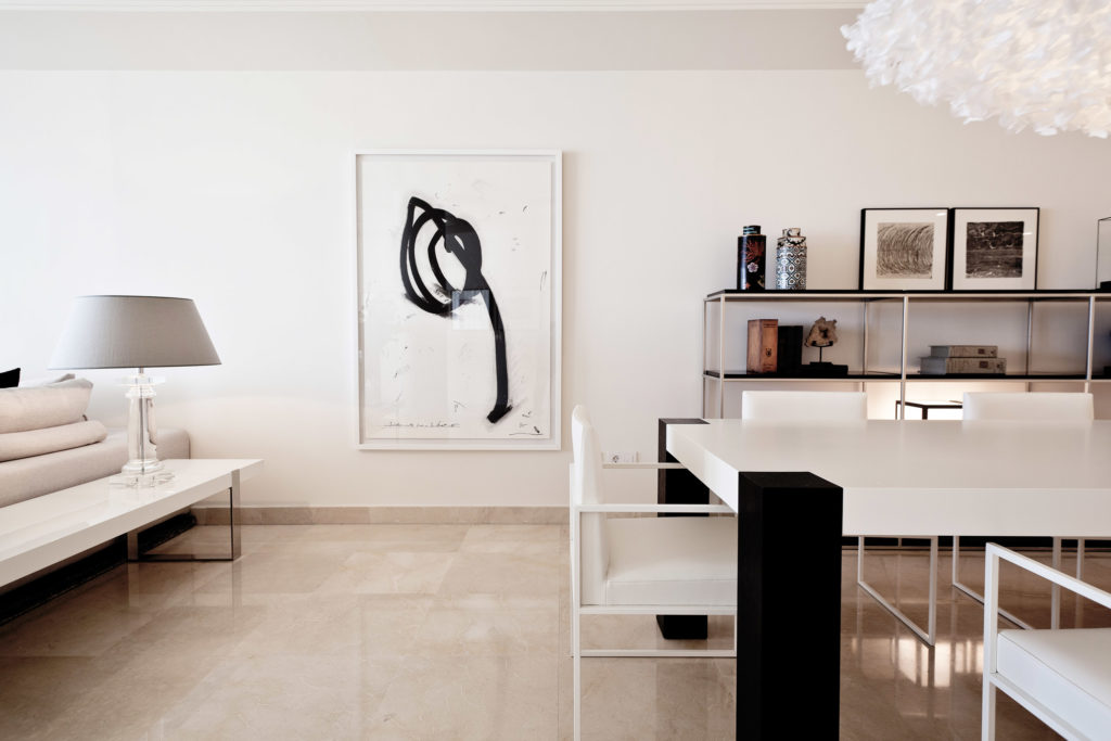 Minimalist style living room in white tones with black decorative elements